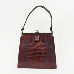 1940s genuine lizard skin handbag  ~Gold tone metal hardware ~Suede lining with metal zipper pocket Condition: Very good. Wear to corners and ink stains in lining. Some handle warp. Dimensions 7 3/8" x 8" x 2.75" Strap drop: 5.5" Message us with any questions! Sarah Vogt Scooter Dress, Gloves Vintage, Lizard Skin, Cotton Gloves, Ink Stains, Handbag Vintage, Vintage 40s, Top Handle Bags, Gold Handbags