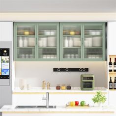 a kitchen with green cabinets and white counter tops