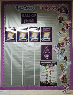 a bulletin board with pictures and stickers attached to it's sides, in front of a purple wall