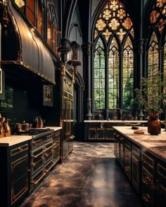 an ornate kitchen with black cabinets and gold accents