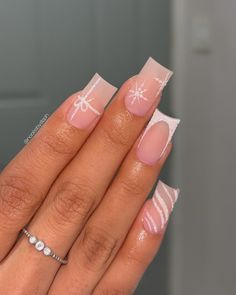 These medium square nails showcase a matte nude base adorned with subtle sparkle details and white snowflake accents. Each nail has a unique design, from gift-wrapped art to soft stripes, adding a fun, winter vibe. Perfect for a playful yet refined winter manicure. Summer Nails Christmas, Short Nail Inspo Winter 2024, Winter Christmas Nails Acrylic Square, Pretty Christmas Nails Square, Nail Inspo Square Christmas, Christmas Nails White Square, Winter Xmas Nails, Christmas Gift Nails Design, Short Simple Christmas Nails Acrylic