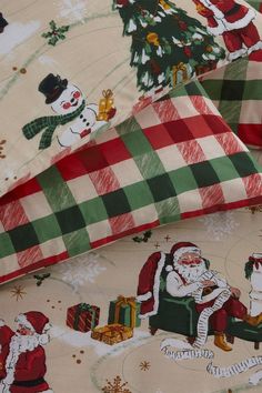 two christmas themed sheets with santa and snowmen on them