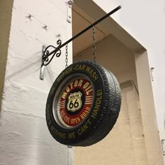 a tire hanging from the side of a building