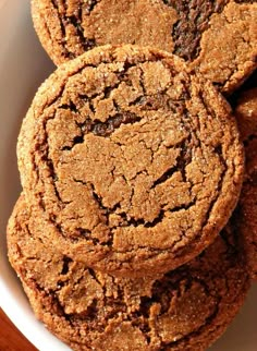 some cookies are in a white bowl on a table