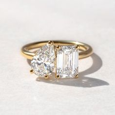 an engagement ring with two diamonds on it