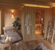 a bedroom with wooden walls and flooring next to a ladder