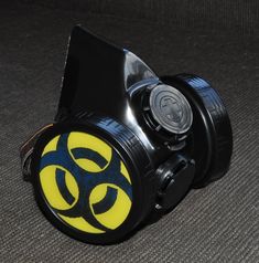 Black Cyber Mask made from PVC and plastic .   Gas Mask has inserts in the shape of a Yellow Sign Biohazard , Inserts a removable easy  D = 2.76 inch. (70 mm)  .   Cyber Goth Mask adult sized. An adjustable elastic band long and strong for easy fit and comfort on anyone. You can choose additional other biohazard , radiation , skull symbols by adding it from my other listing : https://www.etsy.com/listing/1741175014/biohazard-simbol-biohazard-inserts-cyber?click_key=2f9ef91c13e1e2540e1d76a4f61d7aeff83446ba%3A1741175014&click_sum=7b7078f8&ref=shop_home_active_2  Modified for easy breathing. All modification are made by hand ! Hi quality, by ZHOS ! Item new without tags. Good for fashion , festivals, parties, cyber gothic look, like gift . Shipping: We ship within 1-2 business days after clea Black Plastic Costume Accessories For Cosplay, Plastic Halloween Cosplay Costume Accessories, Plastic Costume Accessories For Cosplay Halloween, Plastic Costume Accessories For Halloween Cosplay, Black Sci-fi Masks And Prosthetics For Cosplay Events, Sci-fi Black Masks And Prosthetics For Cosplay, Black Mask Costume Accessories For Themed Events, Black Mask For Themed Events, Black Fandom Cosplay Costume