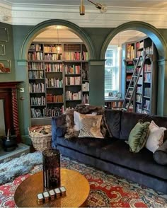 a living room filled with furniture and bookshelves