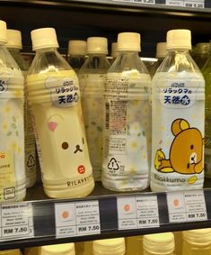 several bottles of baby milk on display in a store