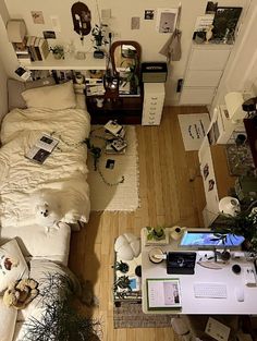 an aerial view of a bedroom with a bed and desk