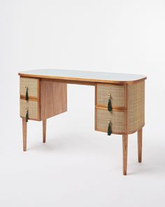 a wooden desk with two drawers on each side