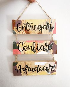 three wooden signs hanging on a wall with the words entregor configurer