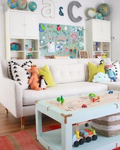 a living room filled with furniture and toys