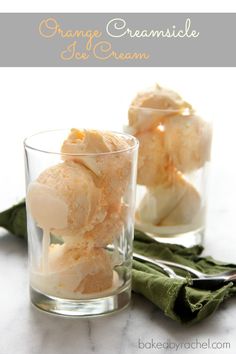 two glasses filled with ice cream on top of a table