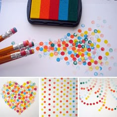 several different colored pencils and markers on a table with polka dot paper in the shape of a heart