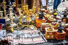 many different types of items on display at an outdoor market