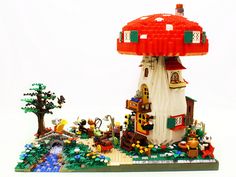 there is a lego mushroom house with lots of people around it and the words gibson goat's toadstool tavern by pandara and rufs