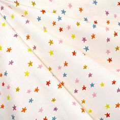 multicolored stars printed on white fabric