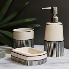 a bathroom set with soap dispenser, toothbrush holder and soap dish