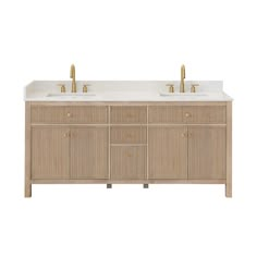 the double sink vanity has two gold faucets on each side and is made out of