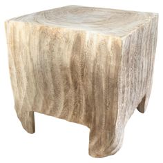 a wooden stool made out of wood with an animal skin pattern on the top and bottom