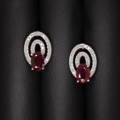 Why we love it:These high quality and classic stud earrings feature rich red oval shape rubies paired with loops of vibrant diamonds.Highlights:- 1.80ctw pair of oval shape rubies with rich red color- 0.40ct of bright white and eye clean diamond accents- Classic 14k white gold settingsDimensions:14.3 x 4.8mm. Red Ruby Earrings, Ivy Rose, Ruby Earrings, Square Diamond, Diamond Stud Earrings, Earrings Studs, Ruby Diamond, Diamond Stud, Diamond Earrings Studs