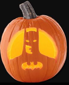 a carved pumpkin with an image of batman on it