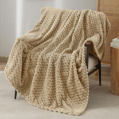 a blanket that is on top of a chair