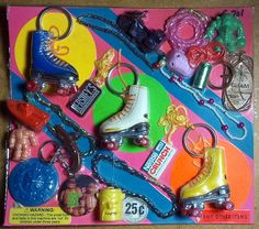 a box filled with lots of different types of toys and keychains on top of a table