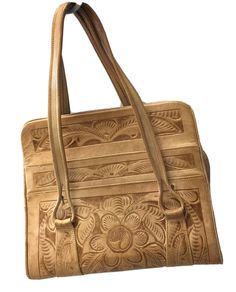 Beautiful Cream leather bag  Handmade / Hand Tooled in Mexico by Avelar.  Boho Satchel Bag Purse Handbag  True vintage heirloom piece from 60’s  Double Hand Strap Handles Zip Closure 4 Exterior Slip Pockets 1 Interior Slip Pocket 1 Interior Zippered Pocket 2 Zippered Divided Compartments Floral Design Motif Approx Measurements: Width 12” height 10” depth 5” drop 6” My home is Pet & Smoke Free! 3C Tote 1 0222-46 Vintage Top Handle Shoulder Bag With Hand Tooled Detail, Retro Hand Tooled Satchel Shoulder Bag, Retro Brown Hand Tooled Shoulder Bag, Hand Tooled Vintage Brown Bohemian Shoulder Bag, Vintage Satchel, Retro Vintage Brown Hand Tooled Shoulder Bag, Hand Strap, Satchel Bag, Leather Bags Handmade