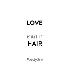 the words love is in the hair are black and white, against a white background