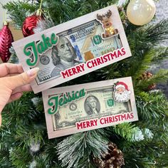 two christmas money bills hanging from a christmas tree