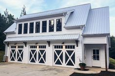 an image of a two story house with garage