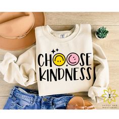 "Choose Kindness Sweatshirt, Kindness Sweater, Be Kind Hoodie, Choose Kindness, Smiley Face, Trendy Shirt, Aesthetic Sweater, Positive Hoodie This listing is for one Choose Kindness Sweatshirt in the color of your choice. 🐝 Sweatshirt Features --> 8 oz., 50% cotton, 50% polyester --> Heather Sport colors: 60% polyester, 40% cotton --> Safety Orange is compliant with ANSI - ISEA 107 High Visibility Standards --> 1x1 ribbed collar, cuffs and waistband with spandex --> Double-needle stitching thro Choose Kindness Shirt, Kindness Teacher Shirts, Kindness Shirts For Kids, Smiley Face Shirt Design, Teacher Sweatshirt Ideas, Kindness Sweatshirt, Positive Hoodie, Aesthetic Sweaters, Art Hoodie