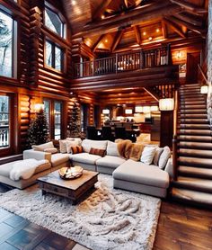 a living room filled with lots of furniture next to a stair case in front of a window