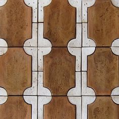 an image of a tile pattern that looks like it has been painted brown and white