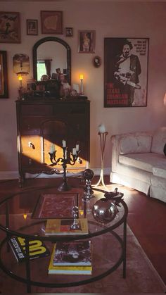 a living room filled with furniture next to a white couch and table in front of a mirror