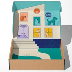 an open cardboard box with a house and dog illustrations on the front, inside and out