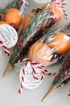 oranges wrapped in cellophane and tied up with twine for christmas ornament