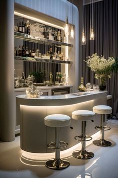 a bar with three stools in front of it