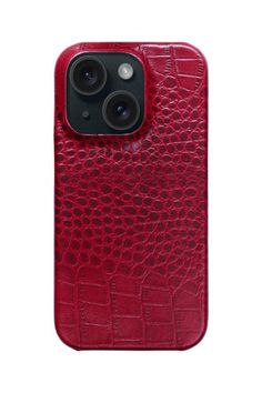 an iphone case with two cameras on the front and one in red crocodile print leather