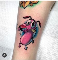 a cartoon character tattoo on the leg