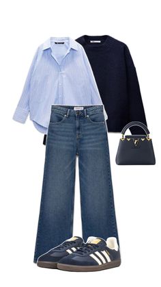 a woman wearing blue jeans and a shirt with white stripes is standing next to a handbag