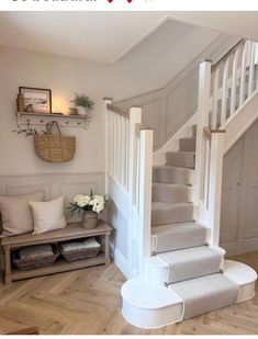 the stairs in this house are made of wood and have been painted white with gray carpet