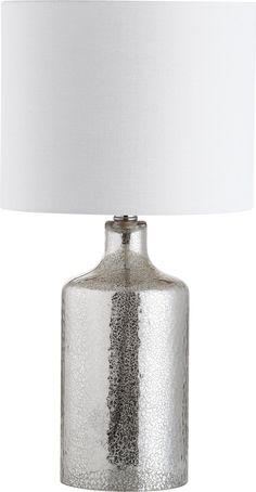 a silver table lamp with a white shade on the base and a light bulb attached to it