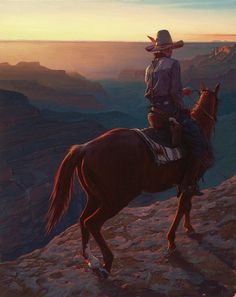 a man riding on the back of a brown horse next to a cliff at sunset