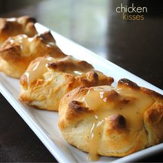 two biscuits covered in caramel sauce on a white plate