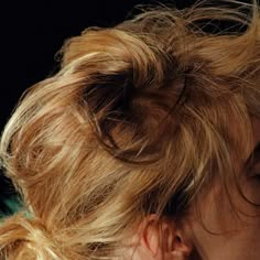 a close up of a woman with blonde hair