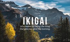 a mountain scene with the words kigai in front of it and trees on the ground