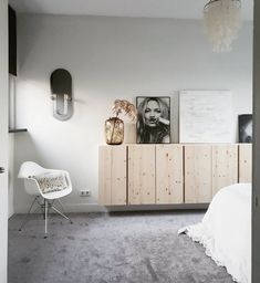 a bedroom with white walls and grey carpet